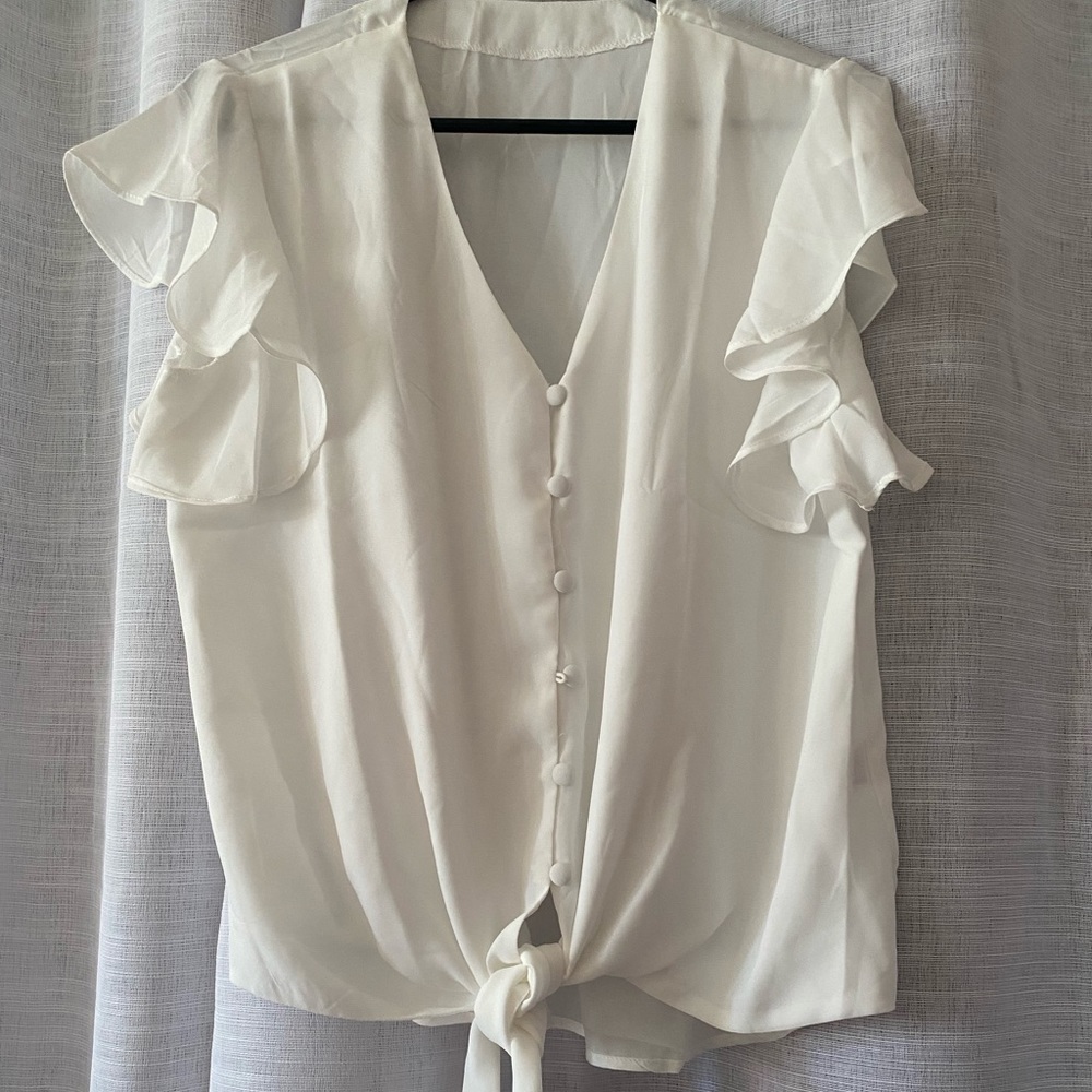 White blouse with flutter sleeves